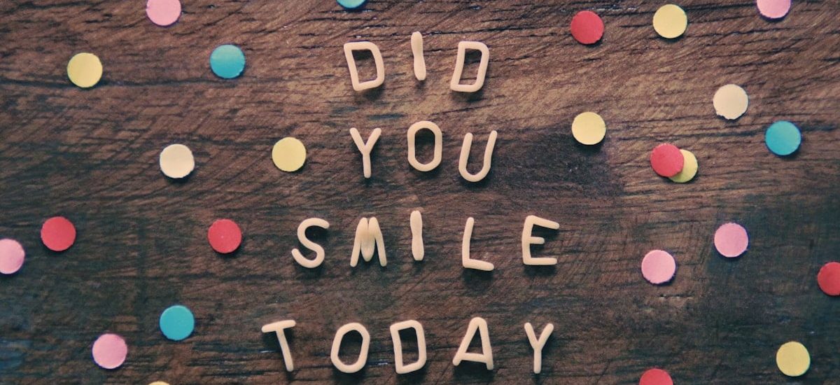 the words did you smile today written on a wooden surface