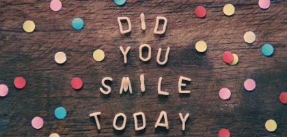 the words did you smile today written on a wooden surface