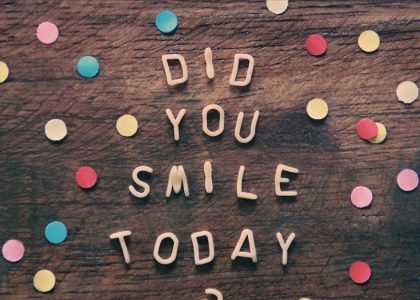 the words did you smile today written on a wooden surface